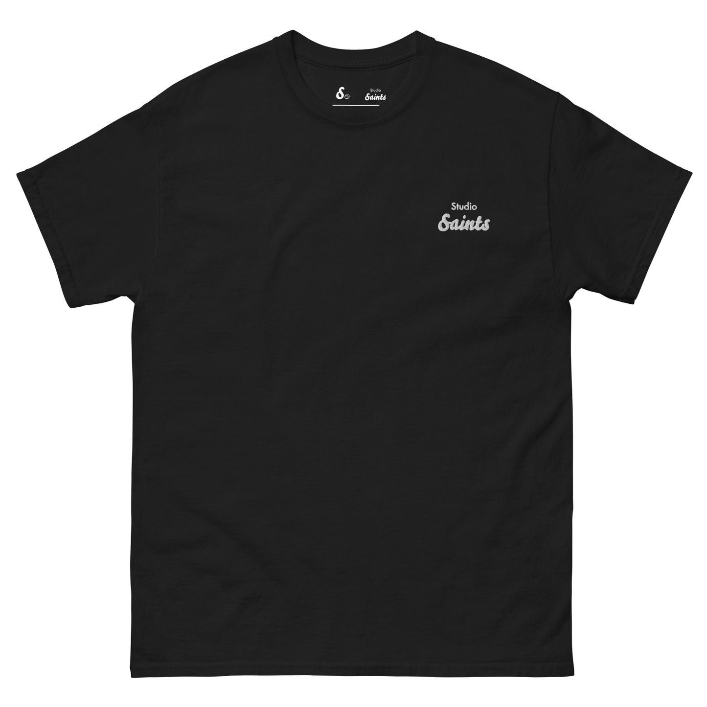 Photo of a black t-shirt with Studio Saints logo on the left chest 